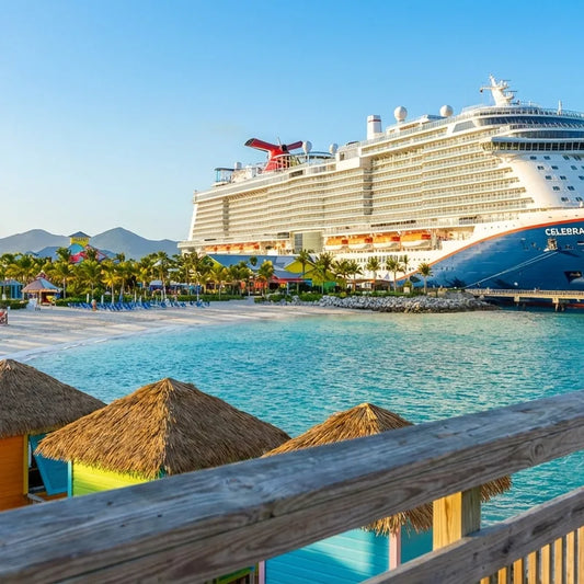 A large cruise ship docked in a tropical Caribbean port during a sunny day in March 2026.