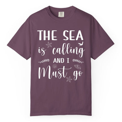 The Sea Is Calling Shirt - Ocean Lover Apparel Beach Vacation Tee (Comfort Color) in Berry - The Sea Is Calling Shirt - Ocean Typography With Shells and Starfish