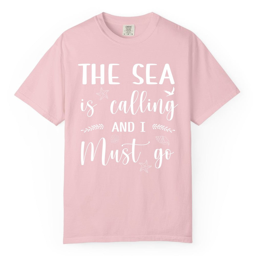 The Sea Is Calling Shirt - Ocean Lover Apparel Beach Vacation Tee (Comfort Color) in Blossom - The Sea Is Calling Shirt - Ocean Typography With Shells and Starfish