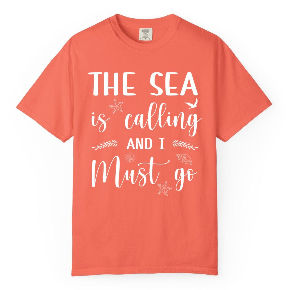 The Sea Is Calling Shirt - Ocean Lover Apparel Beach Vacation Tee (Comfort Color) in Bright Salmon - The Sea Is Calling Shirt - Ocean Typography With Shells and Starfish