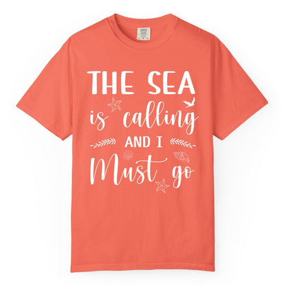 The Sea Is Calling Shirt - Ocean Lover Apparel Beach Vacation Tee (Comfort Color) in Bright Salmon - The Sea Is Calling Shirt - Ocean Typography With Shells and Starfish