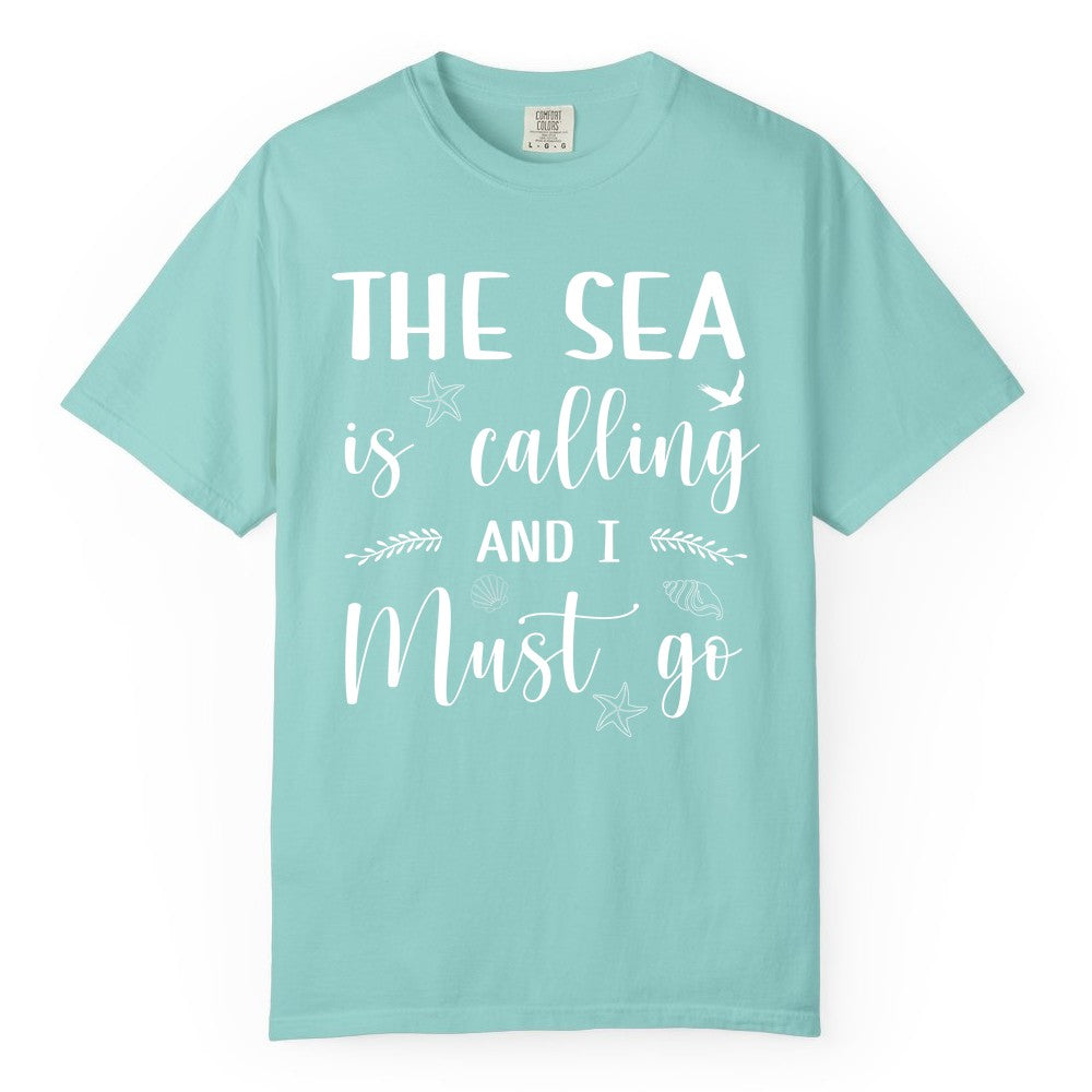 The Sea Is Calling Shirt - Ocean Lover Apparel Beach Vacation Tee (Comfort Color) in Chalky Mint - The Sea Is Calling Shirt - Ocean Typography With Shells and Starfish