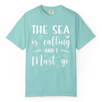 The Sea Is Calling Shirt - Ocean Lover Apparel Beach Vacation Tee (Comfort Color) in Chalky Mint - The Sea Is Calling Shirt - Ocean Typography With Shells and Starfish