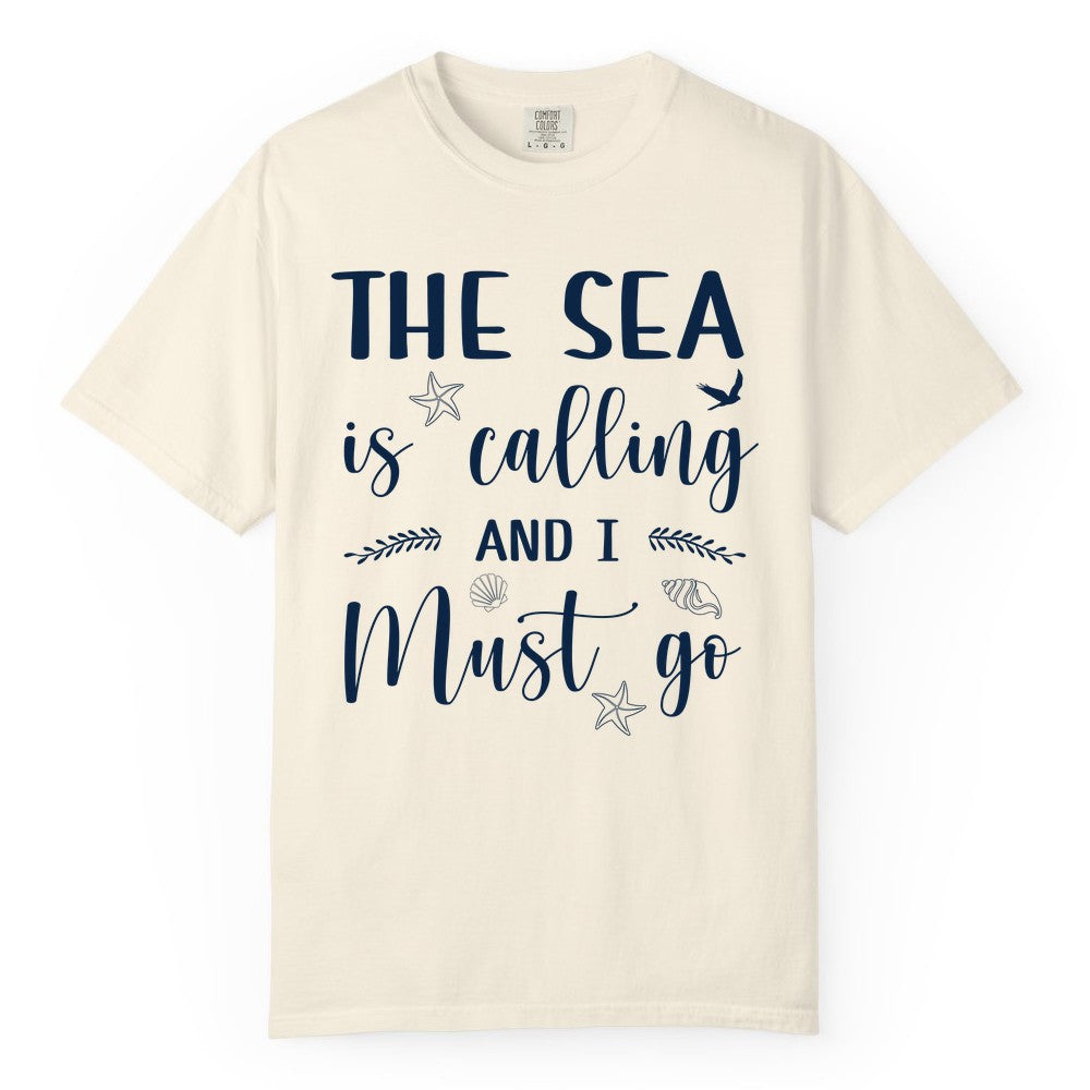 The Sea Is Calling Shirt - Ocean Lover Apparel Beach Vacation Tee (Comfort Color) in Ivory - The Sea Is Calling Shirt - Ocean Typography With Shells and Starfish