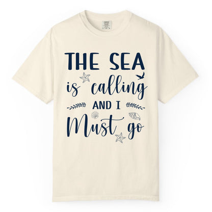 The Sea Is Calling Shirt - Ocean Lover Apparel Beach Vacation Tee (Comfort Color) in Ivory - The Sea Is Calling Shirt - Ocean Typography With Shells and Starfish