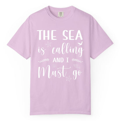 The Sea Is Calling Shirt - Ocean Lover Apparel Beach Vacation Tee (Comfort Color) in Orchid - The Sea Is Calling Shirt - Ocean Typography With Shells and Starfish