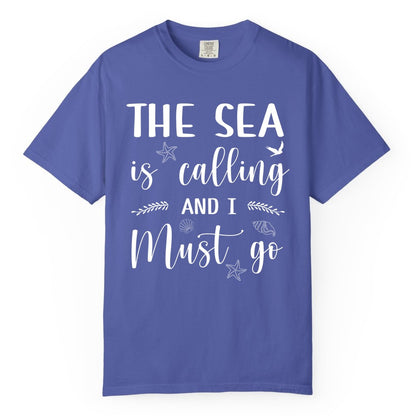 The Sea Is Calling Shirt - Ocean Lover Apparel Beach Vacation Tee (Comfort Color) in Periwinkle - The Sea Is Calling Shirt - Ocean Typography With Shells and Starfish