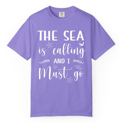 The Sea Is Calling Shirt - Ocean Lover Apparel Beach Vacation Tee (Comfort Color) in Violet - The Sea Is Calling Shirt - Ocean Typography With Shells and Starfish