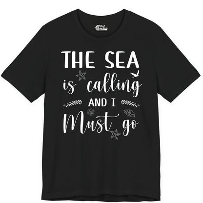 The Sea Is Calling Shirt - Ocean Lover Apparel Beach Vacation Tee (Premium Tee) in Black - The Sea Is Calling Shirt - Ocean Typography With Shells and Starfish