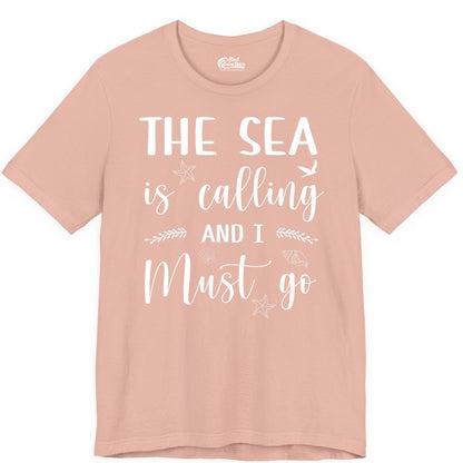The Sea Is Calling Shirt - Ocean Lover Apparel Beach Vacation Tee (Premium Tee) in Peach - The Sea Is Calling Shirt - Ocean Typography With Shells and Starfish