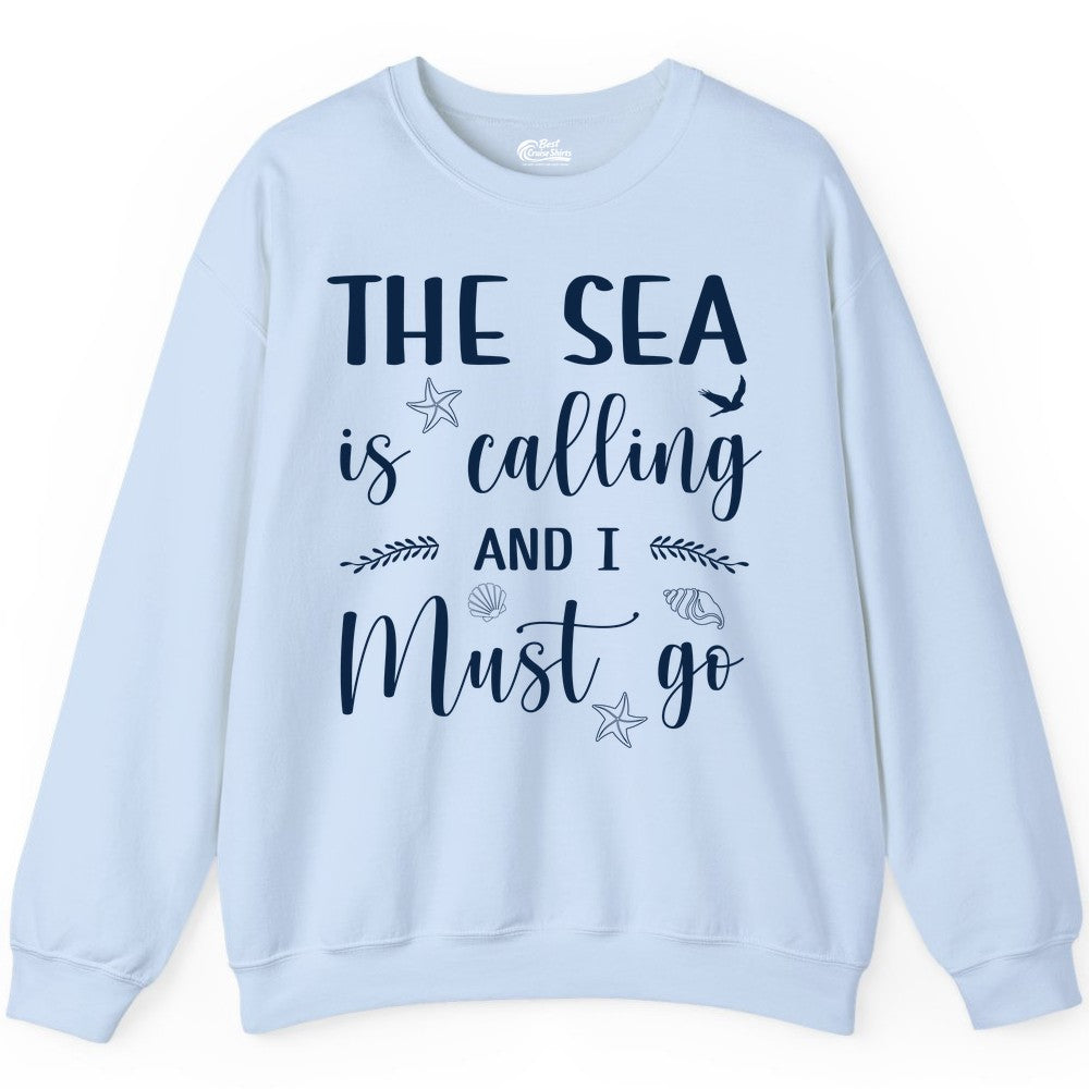The Sea Is Calling Shirt - Ocean Lover Apparel Beach Vacation Tee (Sweatshirt) in Light Blue - The Sea Is Calling Shirt - Ocean Typography With Shells and Starfish