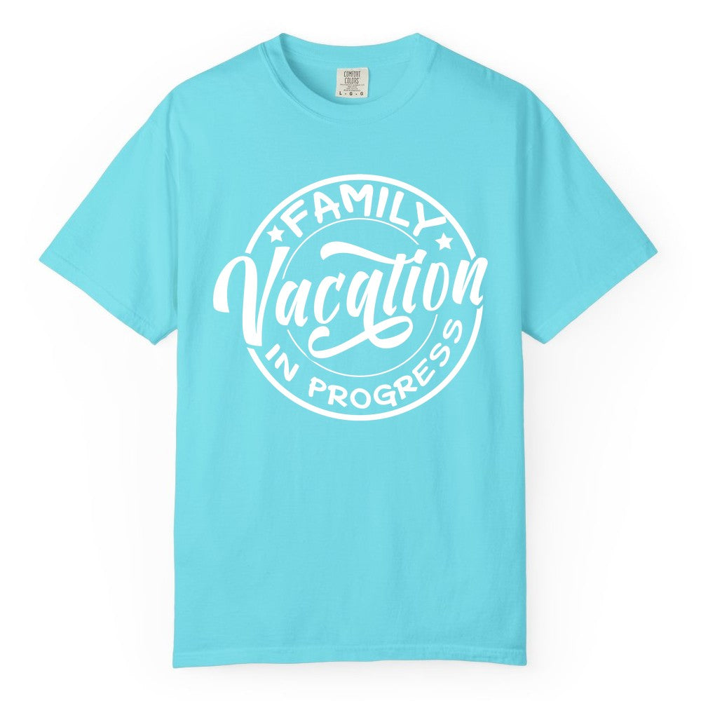 Family Vacation Shirt - Fun Family Travel Shirt for Holiday Trips (Comfort Color) in Lagoon Blue - Family Vacation In Progress Bold Circular Stamp Travel Shirt